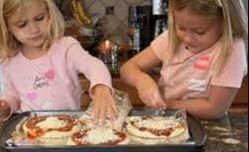 Family making pizza kits